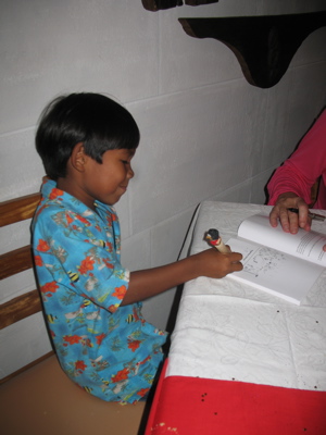 Sam signs one of his illustrations